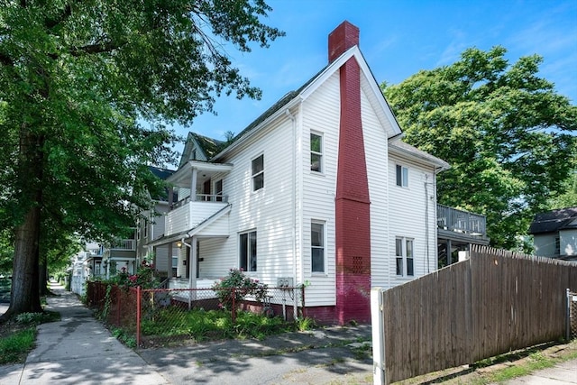 72 Hall St, Springfield, MA 01108 - view of property exterior featuring a chimney and a balcony