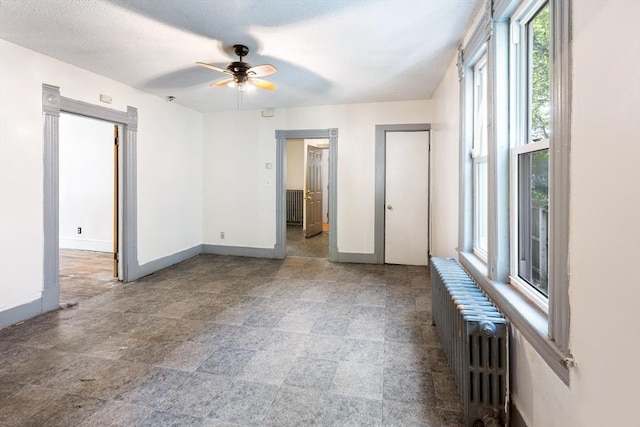 72 Hall St, Springfield, MA 01108 - unfurnished bedroom featuring radiator and a ceiling fan