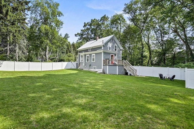 171 Boyce St, Auburn, MA 01501 - rear view of property featuring a fenced backyard, stairs, a chimney, a deck, and view of scattered trees