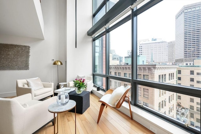 interior space featuring a view of city and wood finished floors