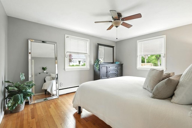 116 Anthony St, Agawam, MA 01001 - bedroom featuring wood finished floors, baseboard heating, and ceiling fan