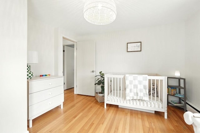116 Anthony St, Agawam, MA 01001 - bedroom featuring wood finished floors and a chandelier