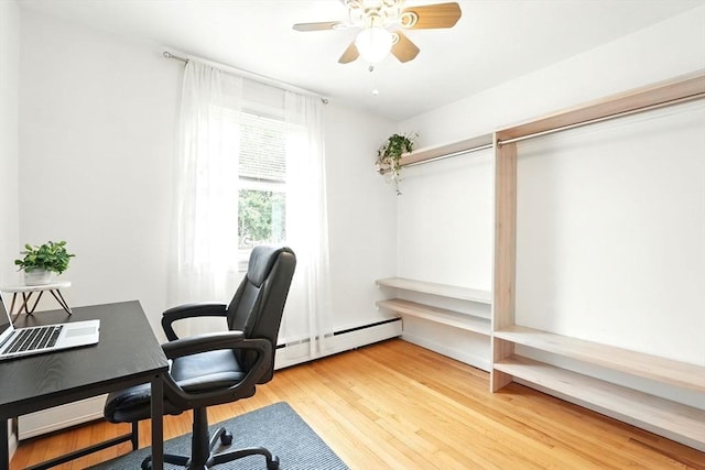 116 Anthony St, Agawam, MA 01001 - office area with baseboard heating, wood finished floors, and ceiling fan