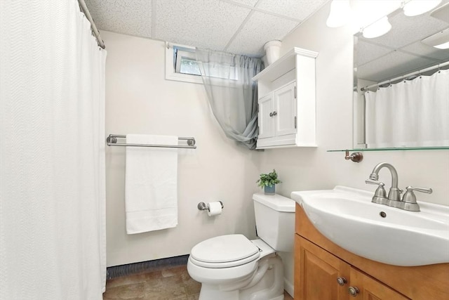 116 Anthony St, Agawam, MA 01001 - bathroom featuring a paneled ceiling, vanity, toilet, baseboards, and a shower with curtain