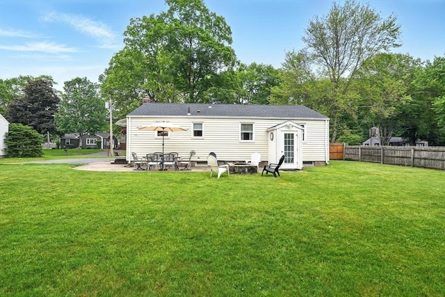 116 Anthony St, Agawam, MA 01001 - back of property featuring a fire pit, a patio, and a chimney