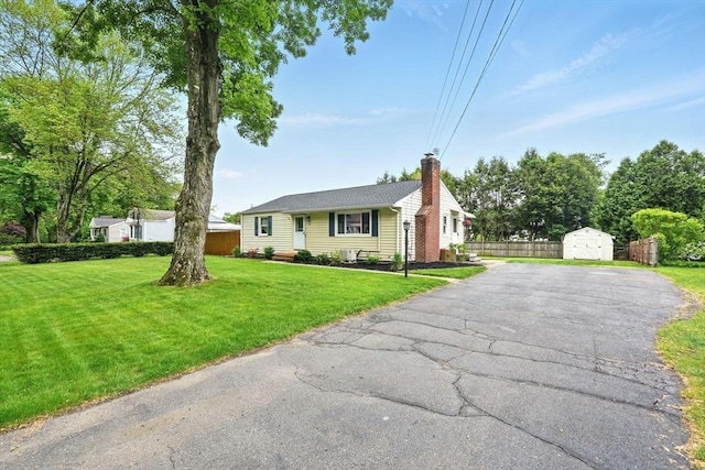 116 Anthony St, Agawam, MA 01001 - view of front of home featuring a chimney and driveway