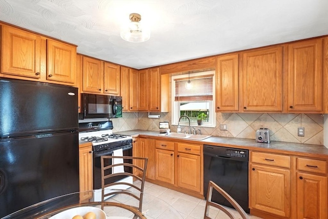116 Anthony St, Agawam, MA 01001 - kitchen with black appliances, a sink, decorative backsplash, and brown cabinets