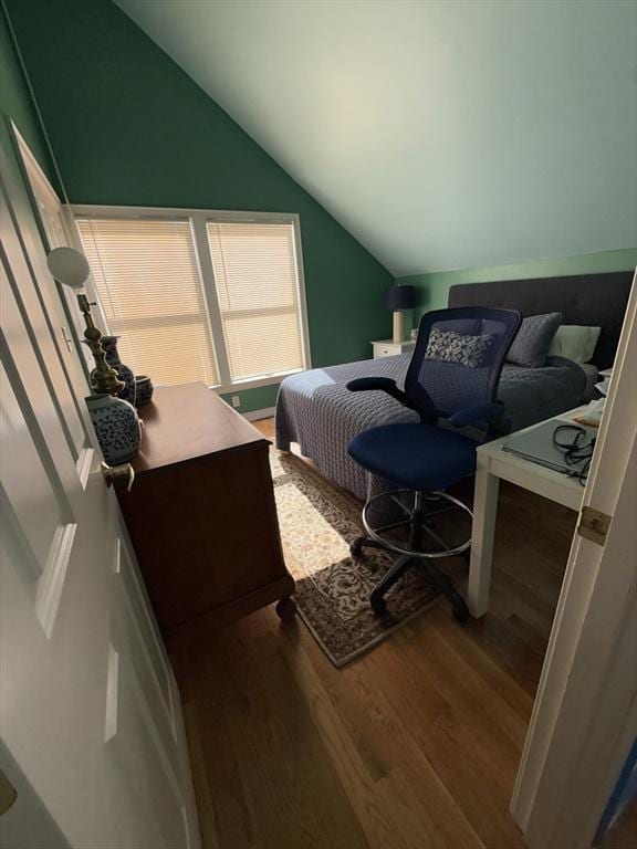 bedroom featuring vaulted ceiling and wood finished floors