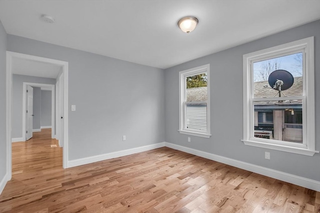 unfurnished room with light wood-type flooring