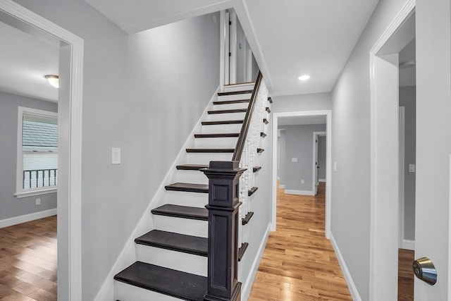 stairway featuring hardwood / wood-style floors