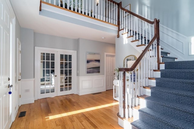 interior space with french doors and wood-type flooring