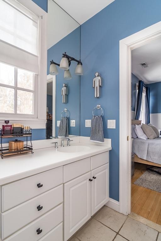 bathroom with vanity and tile patterned flooring