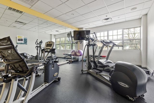 workout area featuring a drop ceiling