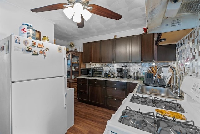 kitchen featuring freestanding refrigerator, dark brown cabinets, light countertops, and ceiling fan