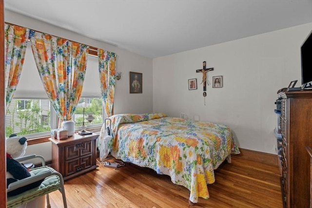 bedroom with wood finished floors