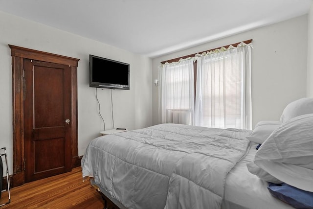 bedroom featuring wood finished floors