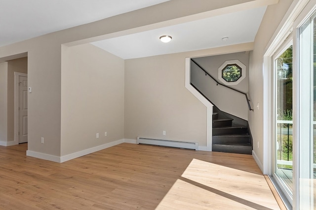 interior space featuring light wood-type flooring and a baseboard radiator