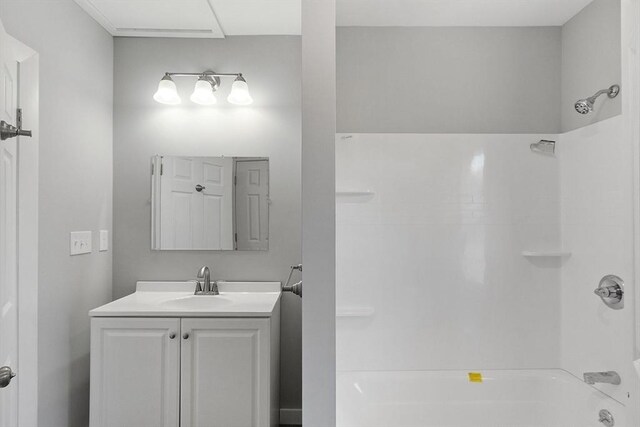 bathroom with shower / bathtub combination and vanity