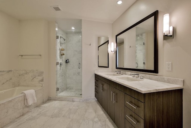 bathroom with vanity and separate shower and tub