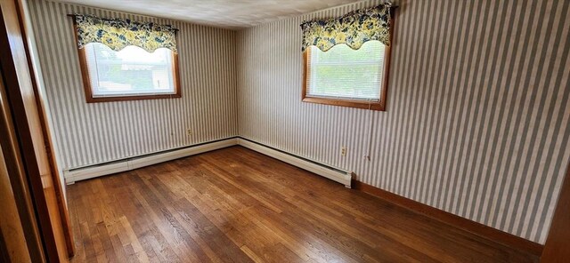 109 Wilder St, Swansea, MA 02777 - unfurnished room with hardwood / wood-style floors, wallpapered walls, plenty of natural light, and a baseboard radiator