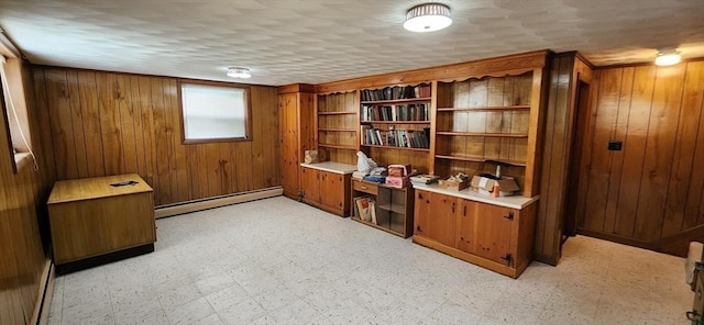109 Wilder St, Swansea, MA 02777 - office area with a baseboard radiator, wooden walls, and light floors