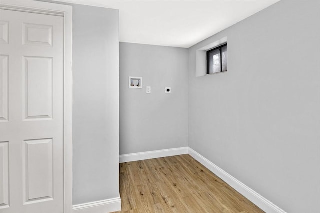 laundry room with electric dryer hookup, washer hookup, and light hardwood / wood-style flooring