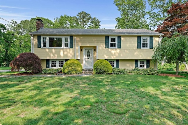 1102 State Rd, Plymouth, MA 02360 - bi-level home featuring a chimney and a front yard