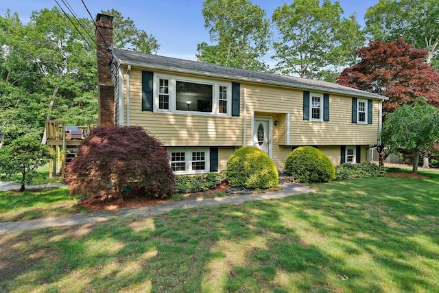 1102 State Rd, Plymouth, MA 02360 - raised ranch with a chimney, a front yard, and a deck