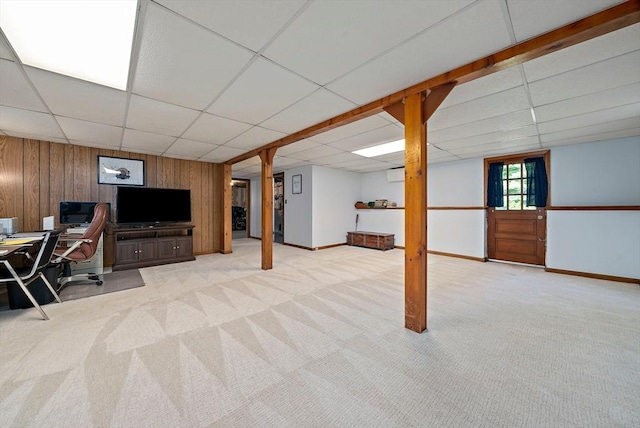 1102 State Rd, Plymouth, MA 02360 - basement with a paneled ceiling, carpet floors, wooden walls, a desk, and an AC wall unit