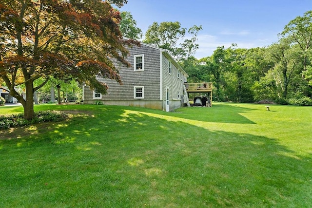 1102 State Rd, Plymouth, MA 02360 - view of home's exterior with a lawn and a wooden deck