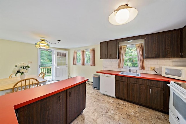 1102 State Rd, Plymouth, MA 02360 - kitchen with white appliances, backsplash, healthy amount of natural light, and dark brown cabinets