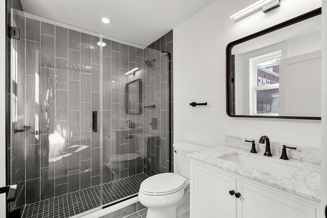 63 Oak St Unit 2, Somerville, MA 02143 - bathroom with toilet, a shower stall, vanity, and recessed lighting