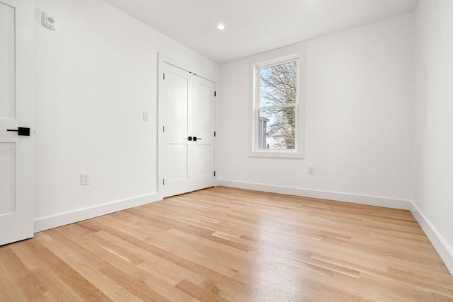 63 Oak St Unit 2, Somerville, MA 02143 - unfurnished bedroom with light wood-style floors, baseboards, and recessed lighting