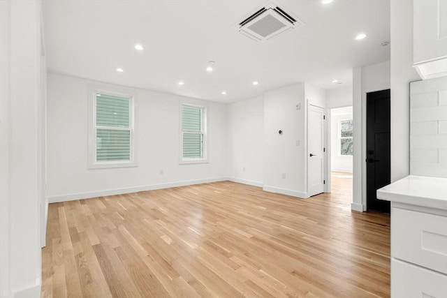 63 Oak St Unit 2, Somerville, MA 02143 - empty room with light wood-type flooring, recessed lighting, and baseboards