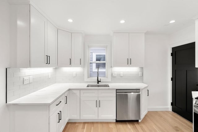 63 Oak St Unit 2, Somerville, MA 02143 - kitchen featuring dishwasher, a sink, light wood-style flooring, decorative backsplash, and recessed lighting