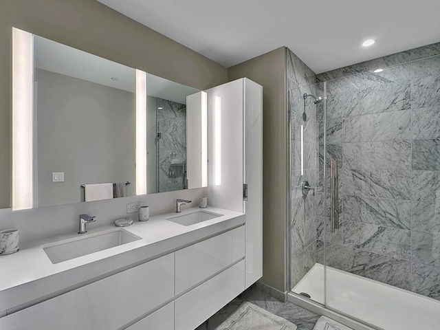 bathroom with vanity and an enclosed shower