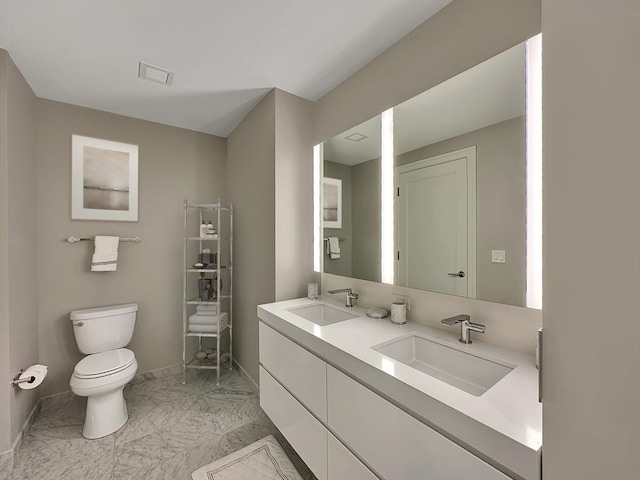 bathroom with vanity and toilet