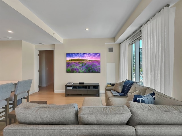 living room with light hardwood / wood-style floors