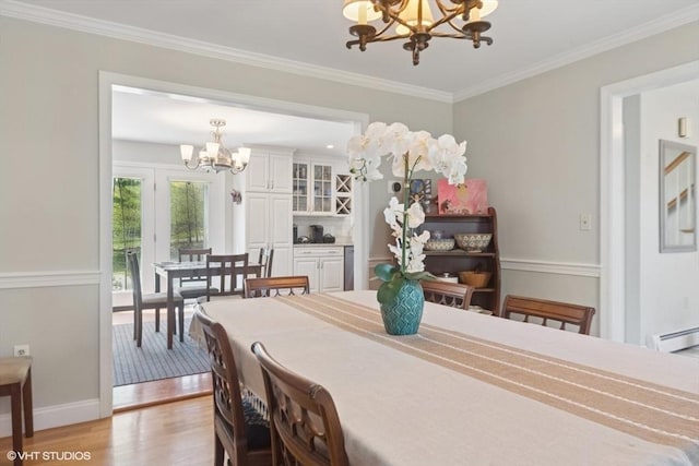 28 Myrtle St, Millis, MA 02054 - dining space with a chandelier, light wood-style floors, a baseboard heating unit, ornamental molding, and baseboards