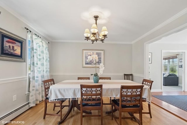 28 Myrtle St, Millis, MA 02054 - dining space with a chandelier, light wood-style floors, baseboard heating, and ornamental molding