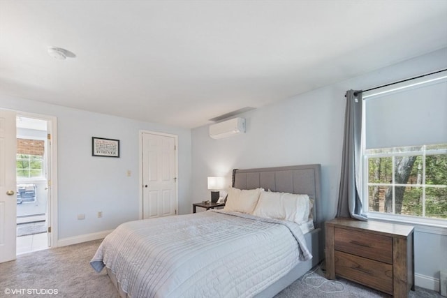 28 Myrtle St, Millis, MA 02054 - carpeted bedroom with a wall mounted AC, baseboard heating, baseboards, and ensuite bath