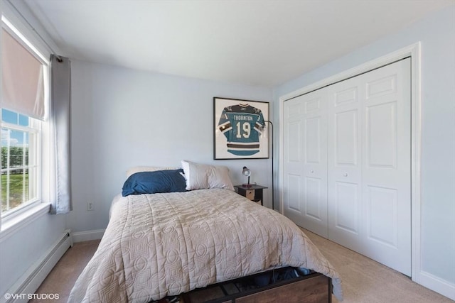 28 Myrtle St, Millis, MA 02054 - carpeted bedroom with a baseboard radiator, a closet, and baseboards