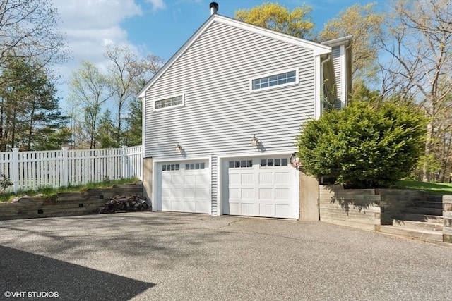 28 Myrtle St, Millis, MA 02054 - view of side of property with asphalt driveway and a garage