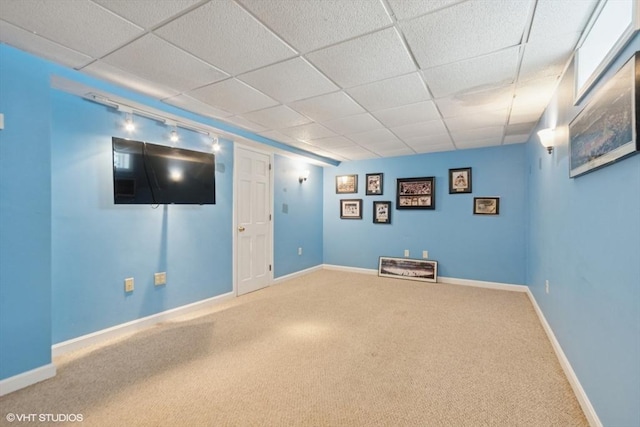 28 Myrtle St, Millis, MA 02054 - finished below grade area with carpet flooring, a paneled ceiling, and baseboards