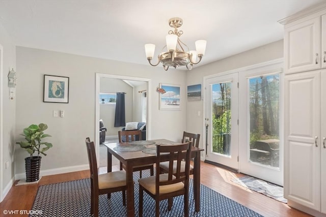28 Myrtle St, Millis, MA 02054 - dining room with a chandelier, wood finished floors, and plenty of natural light