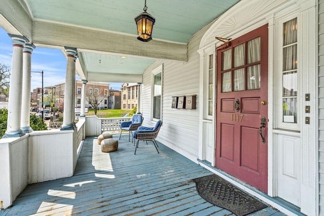 wooden terrace with a porch