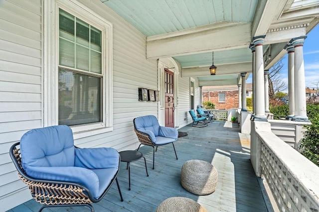 wooden deck featuring covered porch