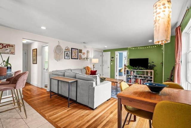living room with recessed lighting and light wood finished floors