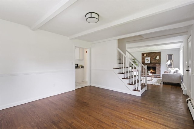 133 Jean Dr, Seekonk, MA 02771 - foyer entrance with beam ceiling, a fireplace, stairway, wood finished floors, and a baseboard radiator