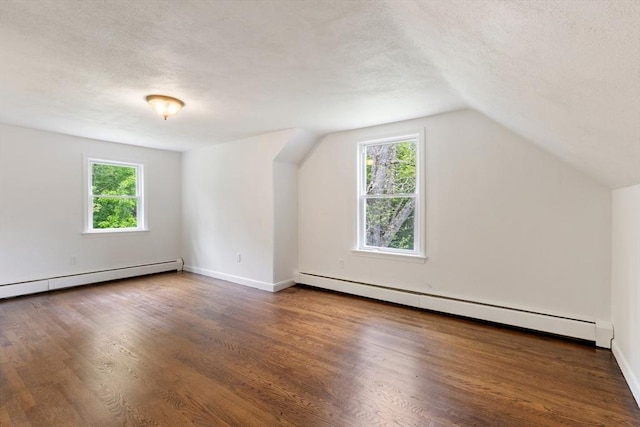 133 Jean Dr, Seekonk, MA 02771 - additional living space featuring baseboard heating, wood finished floors, a textured ceiling, lofted ceiling, and baseboards